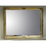 A reproduction gilt framed bevel edged mirror,