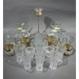 A quantity of cut pressed and decorative glassware including tealight holders, ashtrays, stands,