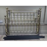 A reproduction Victorian style brass double bedstead with railed ends and ball finials,