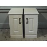 Two reproduction bedside chests with raised fielded panelled doors,