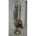 A brass hearth companion set