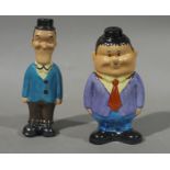 A reproduction Stan and Ollie pottery pepperette and salt pot,