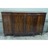 A reproduction mahogany breakfront side cabinet in George III style cross banded throughout and