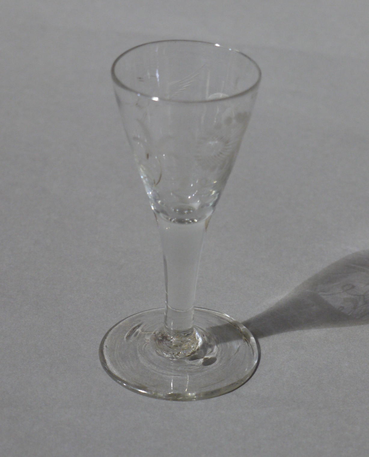 A mid 18th century wine glass with funnel bowl, etched,