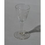 A mid 18th century wine glass with funnel bowl, etched,