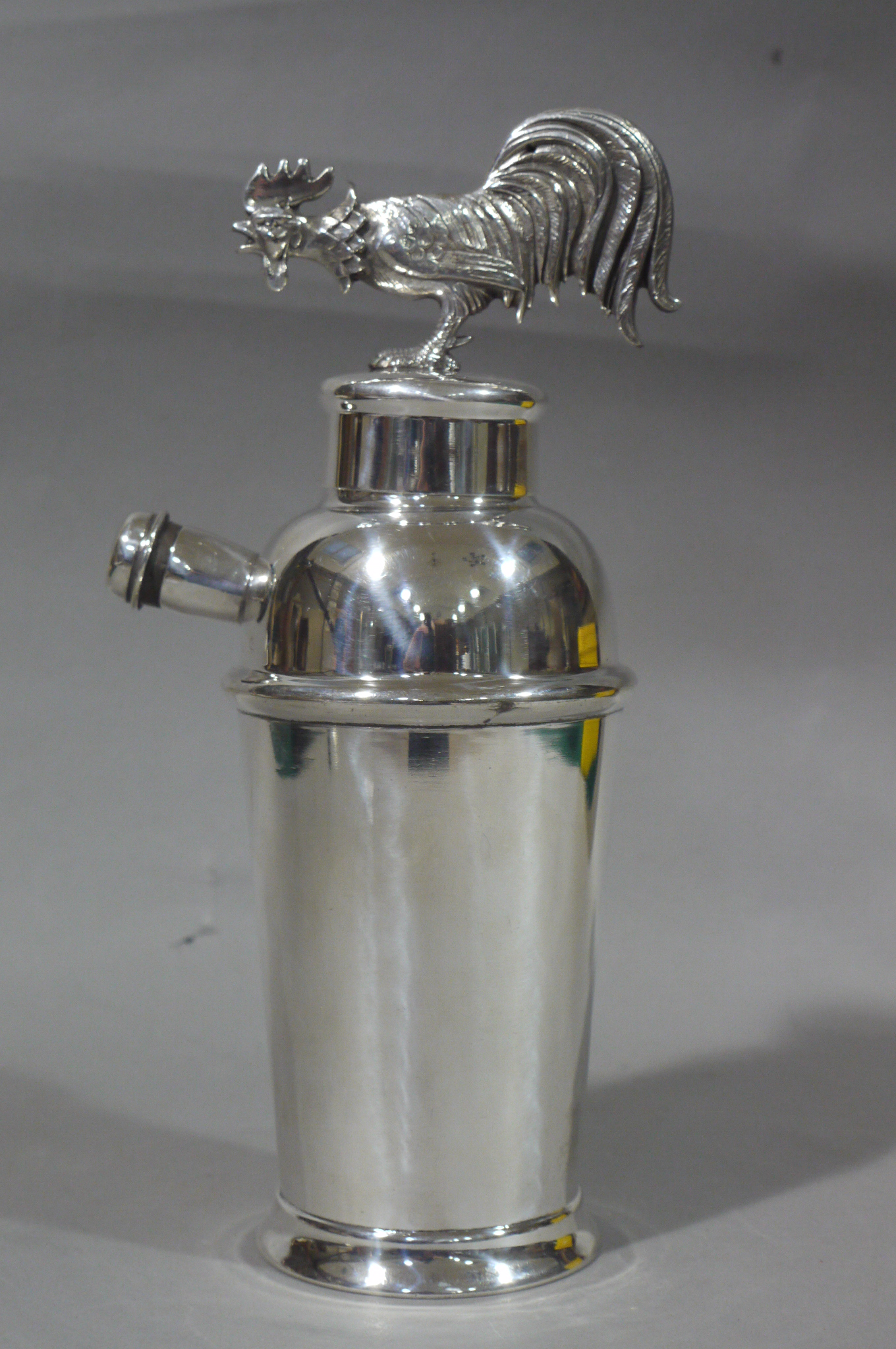 A silver plated cocktail shaker with cockerel finial, 28.