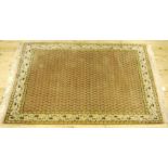 A machine woven bokhara rug, the field worked with leaves on a brown ground, ivory,