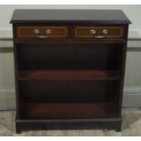 A reproduction mahogany finished set of open bookshelves with two drawers