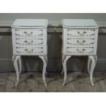 A pair of cream and gilt three drawer bedside cabinets on acanthus angular cabriole legs,