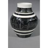 An art pottery baluster vase decorated with horizontal black bands,