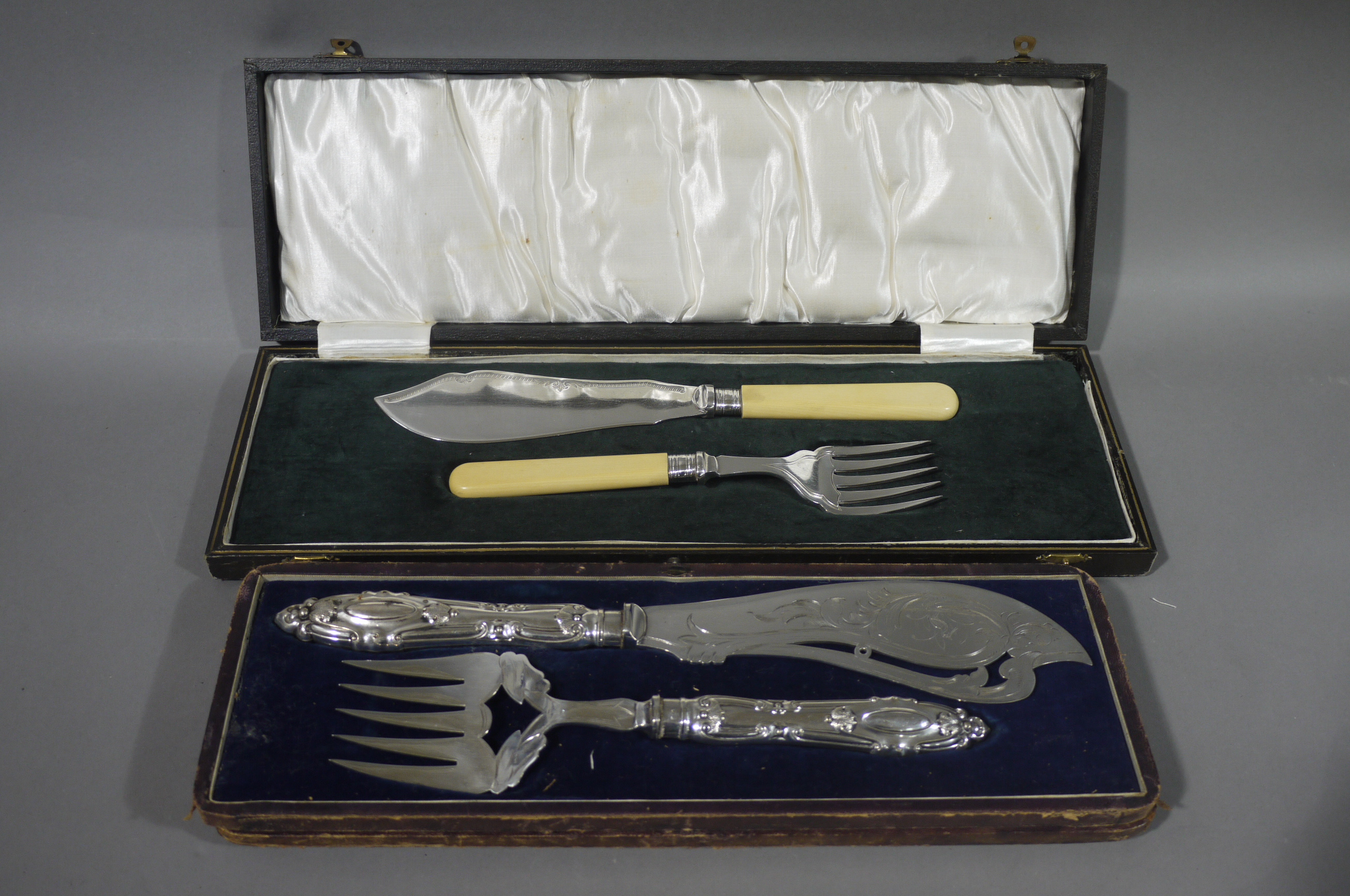 A Victorian pair of silver plated fish servers in fitted case;