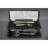 A Victorian pair of silver plated fish servers in fitted case;