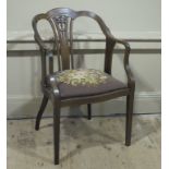 A late Edwardian mahogany open tub chair with pierced splats,