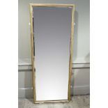 An early 20th century gilt wood reeded wall mirror of rectangular outline