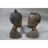 A pair of African carved hardwood tribal busts of male and female,