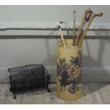 A fibreglass stick stand decorated with roses; together with walking sticks and shooting sticks,