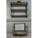 A 19th century mahogany bow fronted toilet mirror having a rectangular glass on turned uprights,