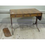 A Regency rosewood veneered sofa table of conventional design fitted with two short and two blind