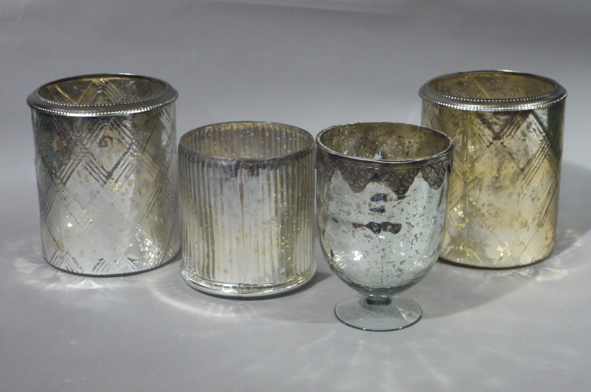 Four silvered glass planters, ribbed,