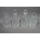 Four cut glass decanters