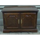 A mahogany finish two door cabinet