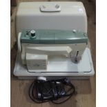 A Merritt electric sewing machine,