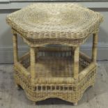 A two tier cane hexagonal occasional table,