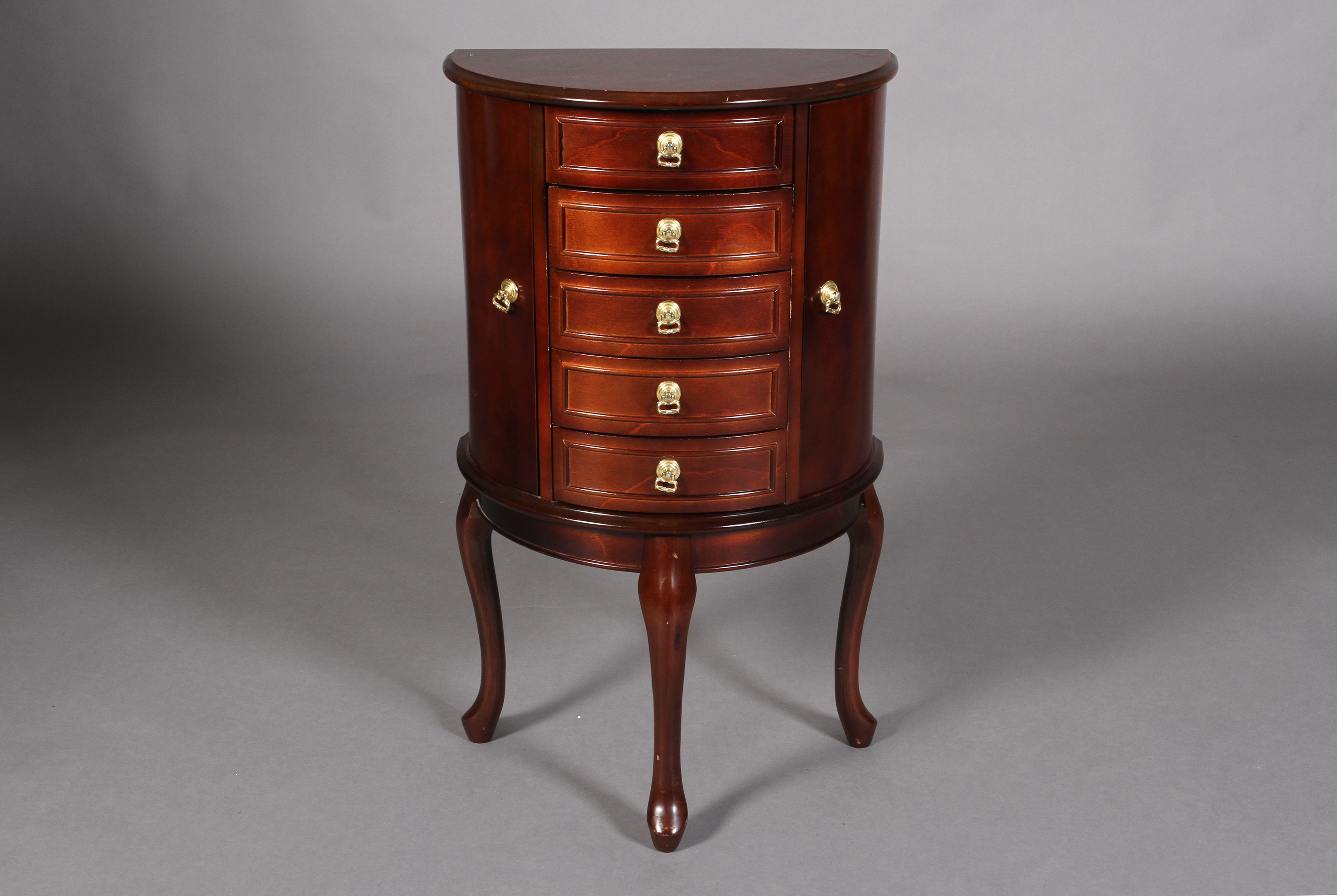A mahogany finish D-shape jewellery cabinet having a lift up mirror lined top above an open - Bild 2 aus 4