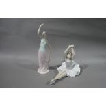 A Nao porcelain ballerina figure, 29cm wide; a Nao figure of young woman her arm aloft,