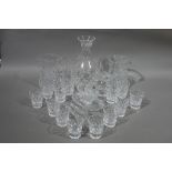 A quantity of miscellaneous cut glass ware including jugs, vase,