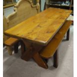 A pine refectory table on X-frame together with a pair of matching benches,