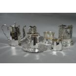 A small quantity of miscellaneous plated ware including bottle coasters, three piece tea serves,