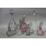 Three cut glass decanters and four cut glass scent bottles (7)