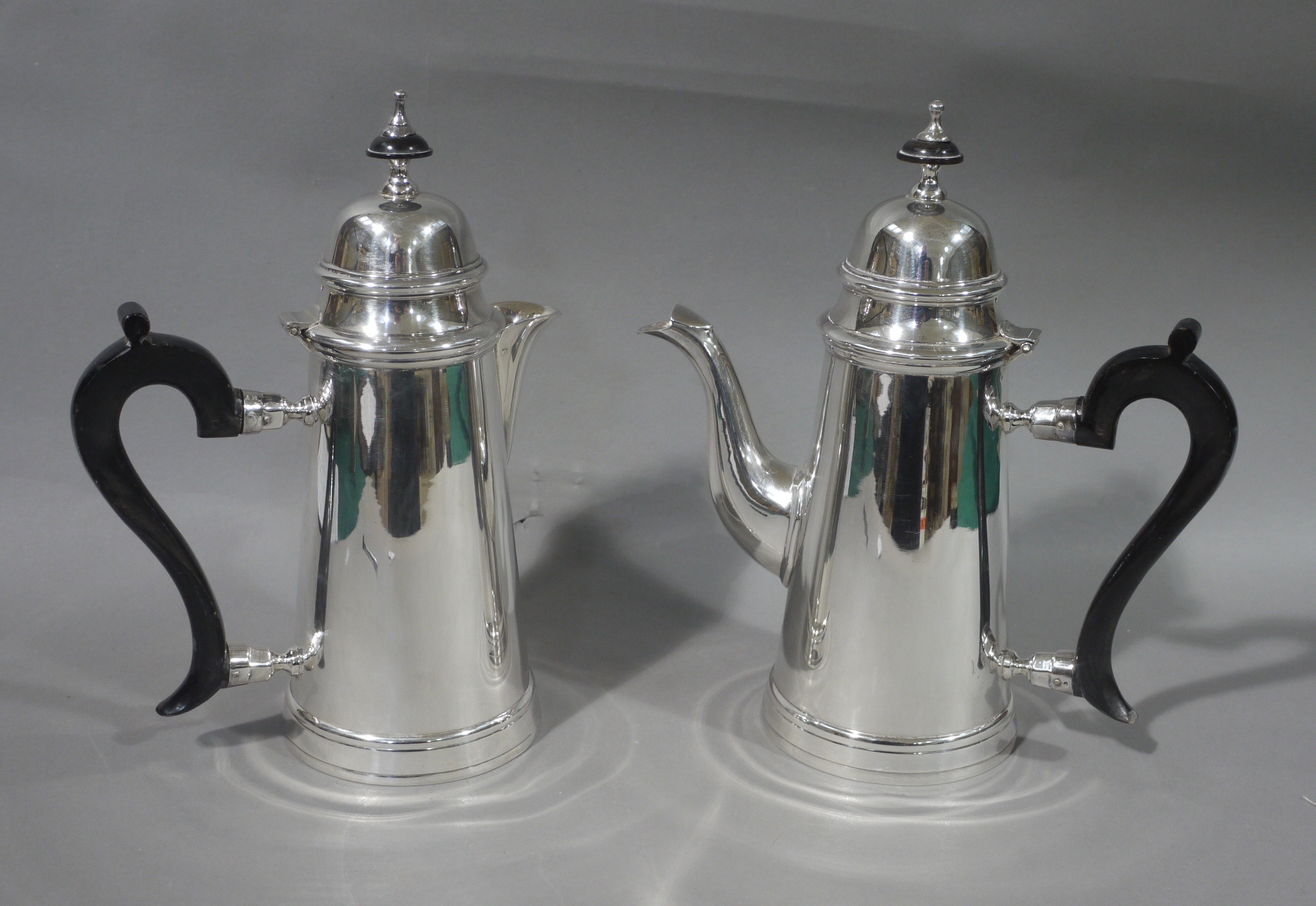 Queen Anne style silver plated coffee pot and hot milk jug each with domed cover,
