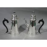 Queen Anne style silver plated coffee pot and hot milk jug each with domed cover,