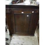 An 19th century oak and mahogany banded corner hanging cupboard,