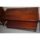 A reproduction mahogany TV stand outlined with crossbanding,