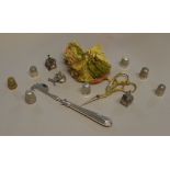 A small quantity of silver and other thimbles,