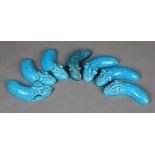 A set of six Mintons majolica turquoise glazed wall pockets, impressed Mintons 'D',