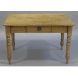 A Victorian pine kitchen table, the frieze fitted one short drawer on turned tapered legs,