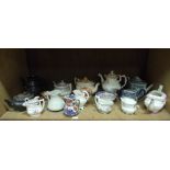 A quantity of early 19th century and later tea pots, jugs including Masons,