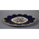 An Emaux de Longwy faience renaissance oval platter decorated with a circular panel of flowers and