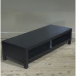 A black ash television and game station stand,