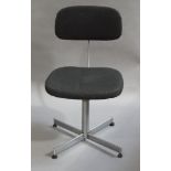 A vintage office chair with adjustable back,