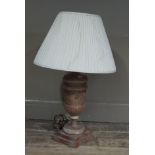 An urnular composite table lamp with pleated cream shade,