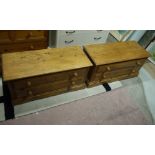 A pair of reproduction pine two drawer chests shaped apron bracket feet, turned wood handles,