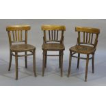 Three bentwood chairs with concave cresting rails above four vertical splats,