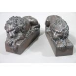 A pair of bronzed white metal models of the lion of Lucerne,