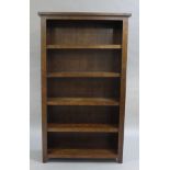 A mahogany stained open bookcase with four adjustable shelves,