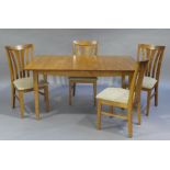 An extending cherry kitchen table and set of four chairs,